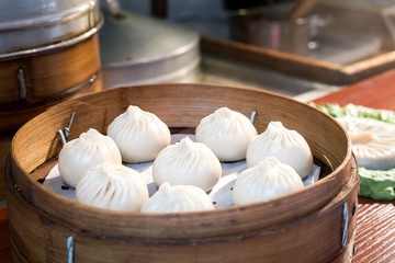 Chinese food steamed bun in bamboo basket in food market