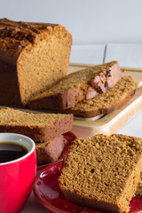 Gingerbread Loaf on White Wooden Table Vertical