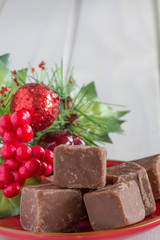 Christmas Chocolate Fudge on White Wooden Table with Copy Space Top Vertical