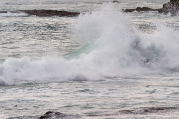 waves crashing on rocks