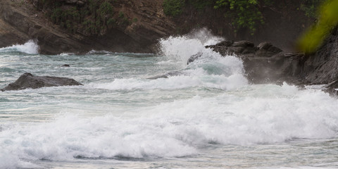 waves crashing on rocks