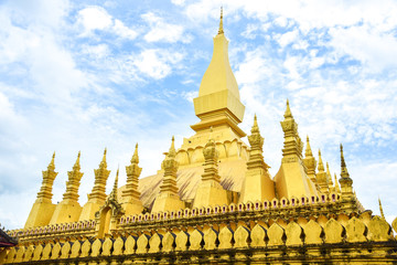 The Golden Pagoda of Wat Phra That Luang Against the Blue Sky in Vientiane, Laos