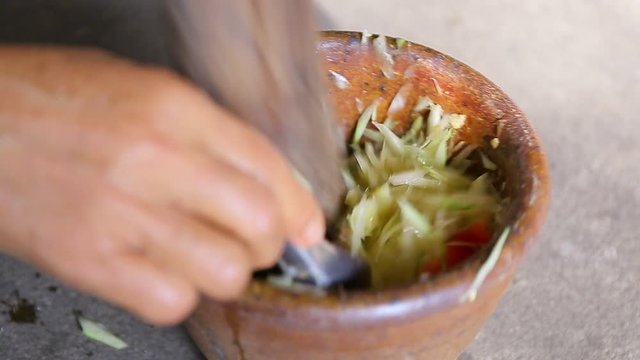 Thai people cooking Green Papaya Salad Recipe or Som Tum