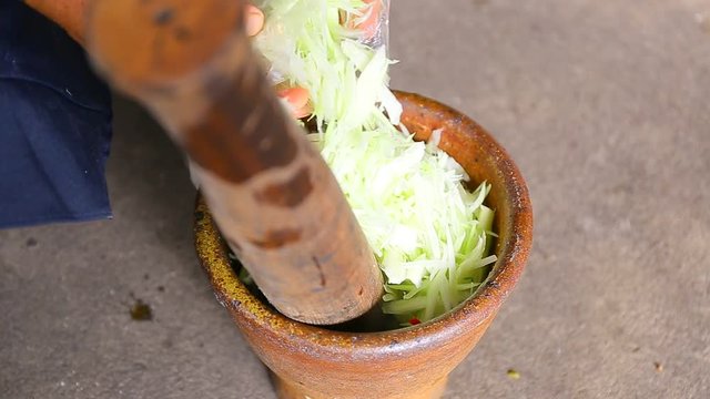 Thai people cooking Green Papaya Salad Recipe or Som Tum