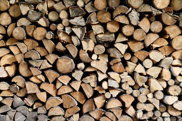 Stacked firewood close up - background