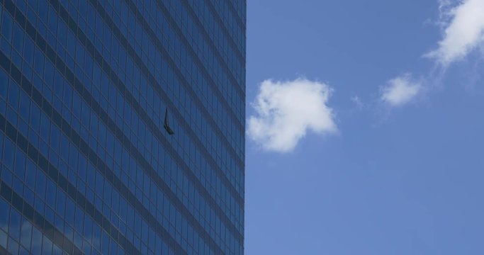 Clouds run near blue high-riser