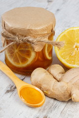 Fresh lemon, honey and ginger on wooden table, healthy nutrition