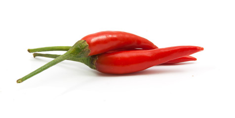 red chili peppers closeup view isolated