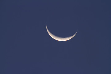 Fototapeta na wymiar Crescent Moon on blue sky.