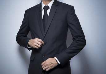 Obraz na płótnie Canvas Businessman Dressing Up a Black Suit
