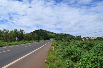 Fototapeta na wymiar asphalt road lead to the mountain