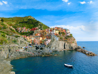 Colorful traditional houses on a rock over Mediterranean sea, Manarola, Cinque Terre, Italy