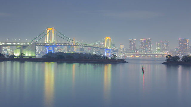 Odiaba rainbow bridge with Tokyo city background, night view, Japan