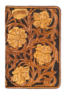 vintage leather passport cover with embossed flower on an isolat