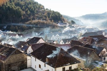 Smoking chimneys in the village of Ochagavia