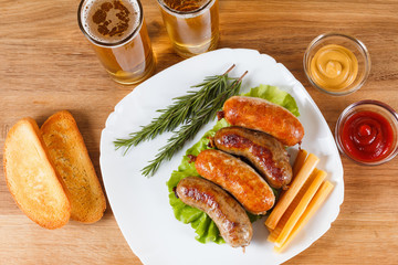Beer and grilled sausage. Oktoberfest traditional menu.