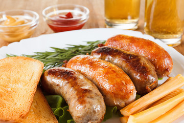 Beer and grilled sausage. Oktoberfest traditional menu.
