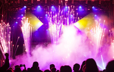 Cheering crowd in front of stage lights - retro photo