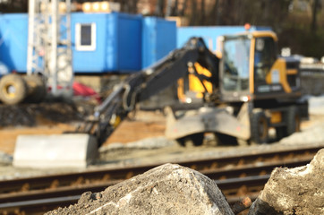 Fototapeta premium Construction digger, excavation outside the depth of field