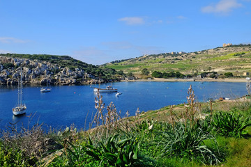 Fototapeta na wymiar Mistra, a beautiful bay between Xemxija and Mellieha, on the west coast of Malta.