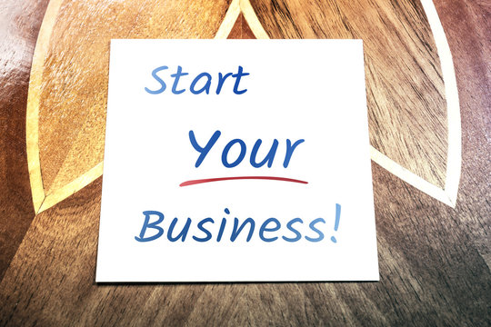Start Your Business Reminder On Paper Lying On Wooden Table