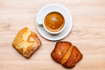 german baps with coffee on wooden