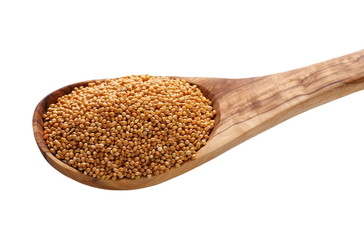 Millet with wooden spoon isolated on white background