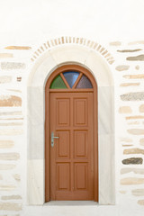 Arched doorway of the local church of Marpissa village at Paros island.
