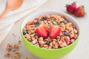 Muesli with strawberry in bowl for healthy breakfast