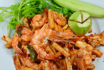 spicy stir fried shrimp with coconut shoot on dish