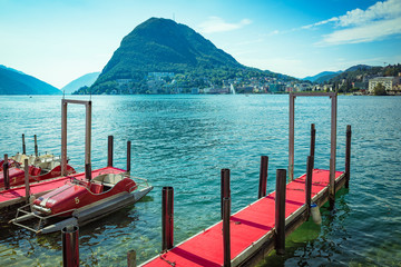 Red pedalos ready for rent in Lugano, Switzerland