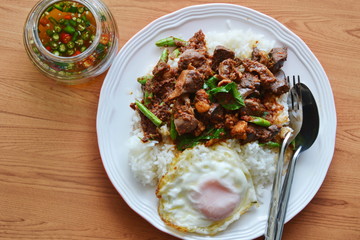 spicy stir fried chicken entrails curry and egg with fish chili sauce cup