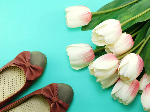 Womens Flats Shoes And Tulips Flower On Green Background