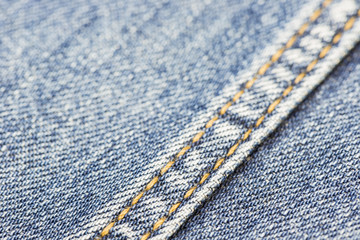 Blue denim with yellow stitching.