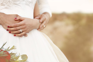 Bride and groom at their wedding day outdoors