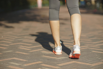 Fototapeta na wymiar closeup of female walking legs after jogging