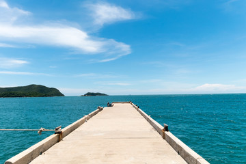 Bridge extending to the sea