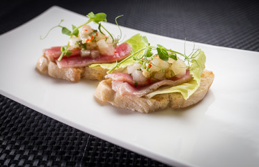 bruschetta with tuna on white palat