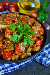 vegetable stew of eggplant on a black background