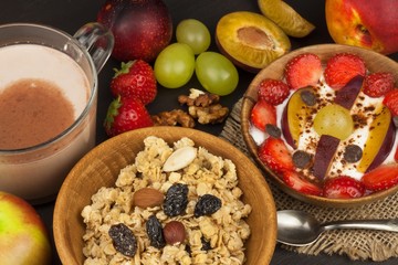 Healthy breakfast with cereals and colorful fruits. Yogurt with fruit and oatmeal. Meals for successful athletes. Food for kids.
