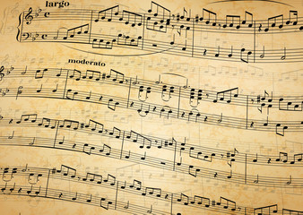 Music notes on stave, old paper background