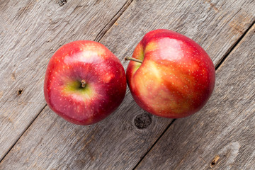 Apples on wooden background.