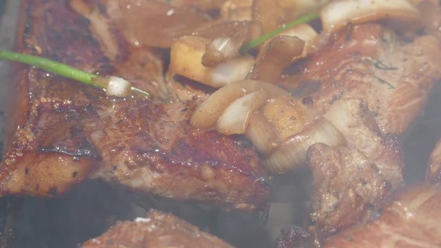 Close up of Pork Meat Steak on Barbecue Grill