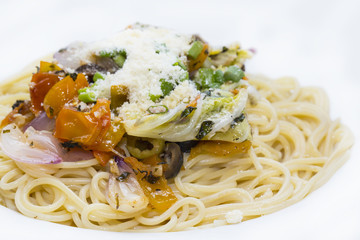 Spaghetti with vegetables and basil olives and cheese