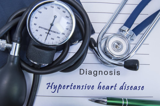 Diagnosis Hypertensive heart disease. A stethoscope, sphygmomanometer with a cuff lie on medical form documentation with diagnosis Hypertensive heart disease in office doctor of internal medicine