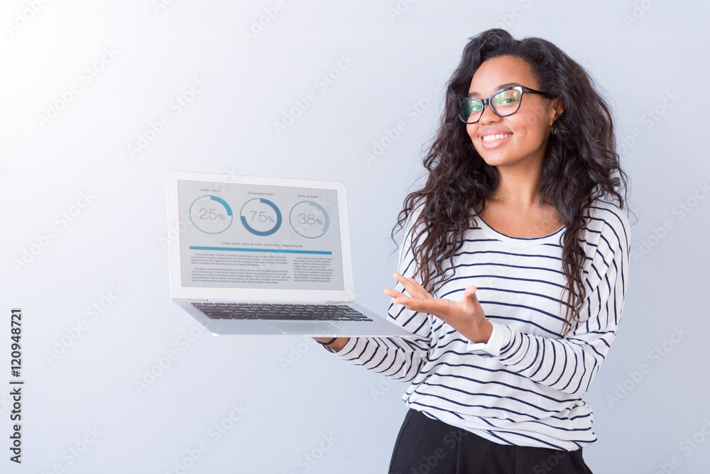 Wall mural cheerful woman holding laptop