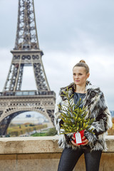 fashion-monger with Christmas tree looking into distance, Paris