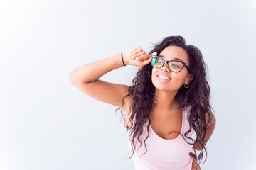 Joyful woman wearing glasses.