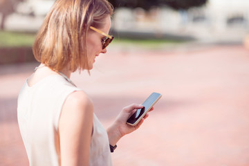 Attractive young woman using phone