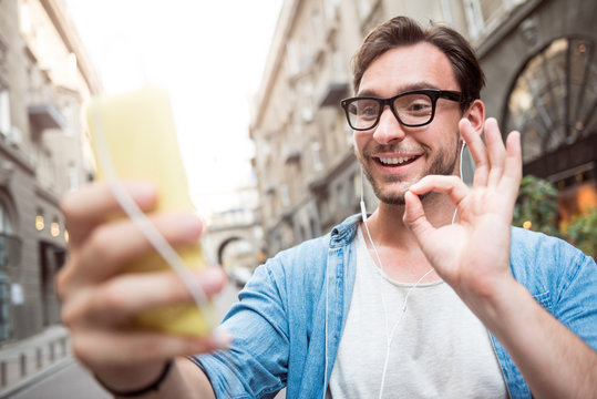 Handsome young man using phone